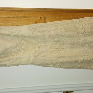 Lace dress in beige with bow across back